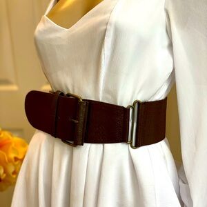 Brown leather waist belt, brass metal, leather and elastic. Very unique design
